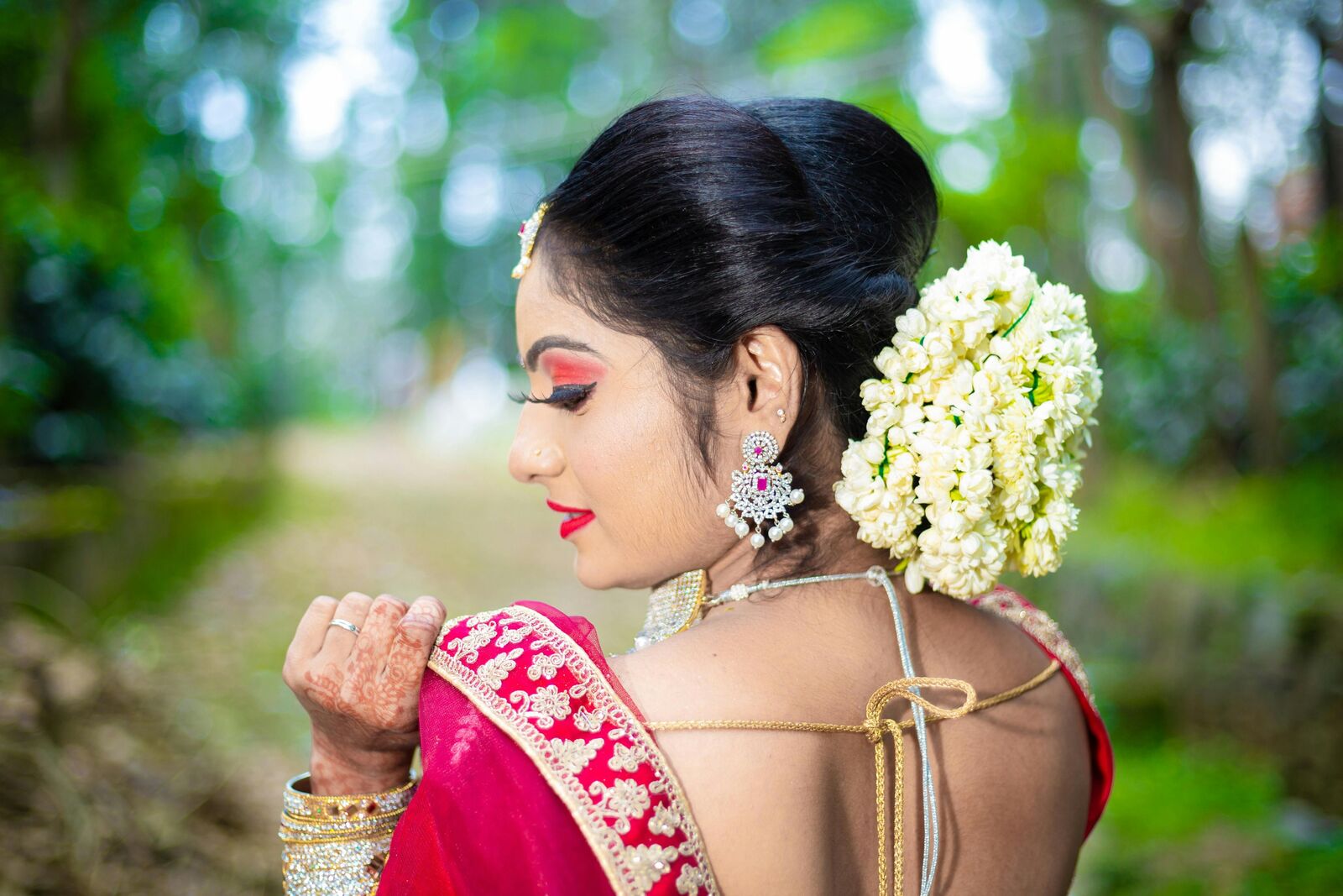Bride from behind with jasmine in her hair