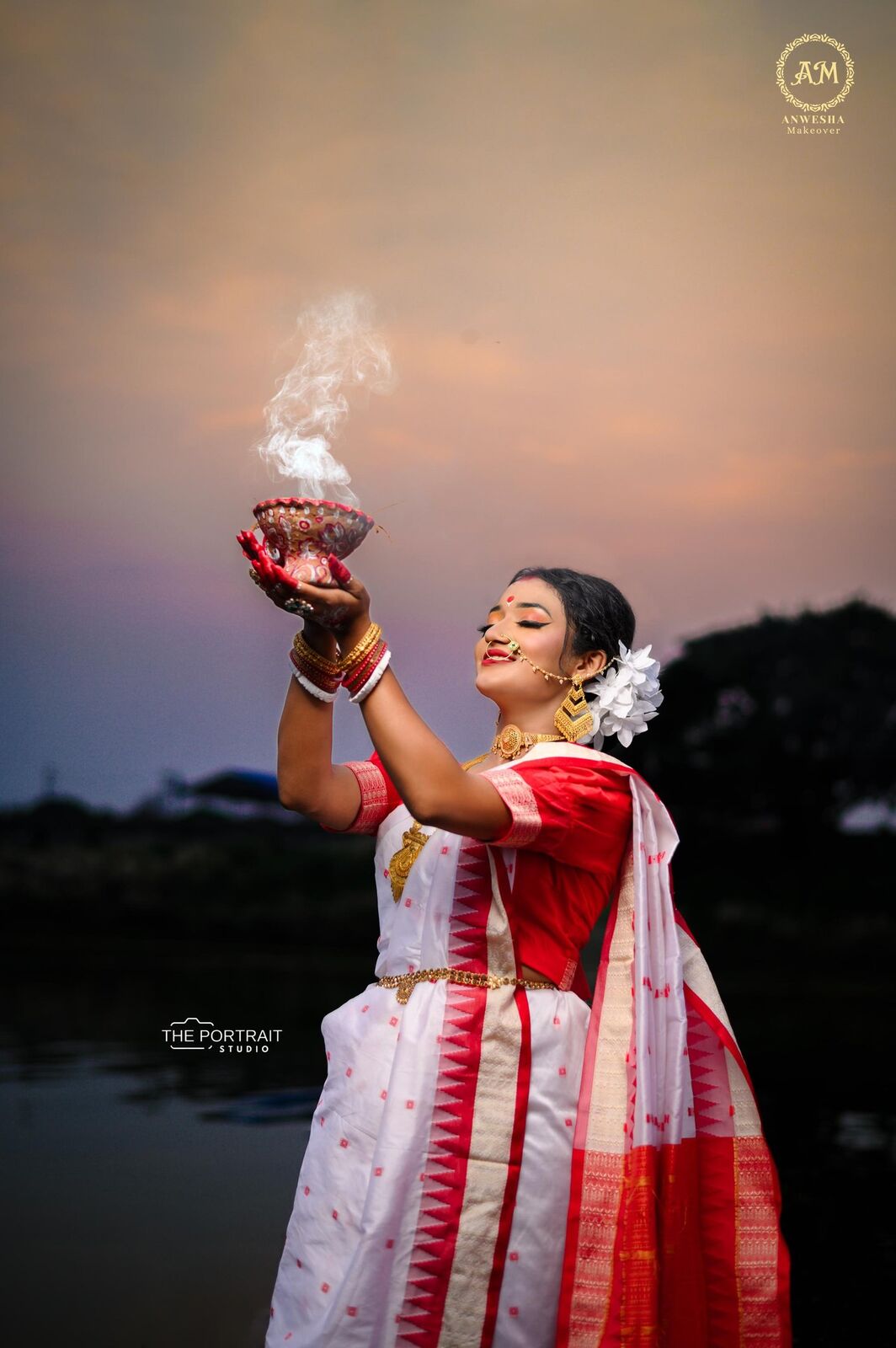 Bride holding a smoking ritual pot at dusk