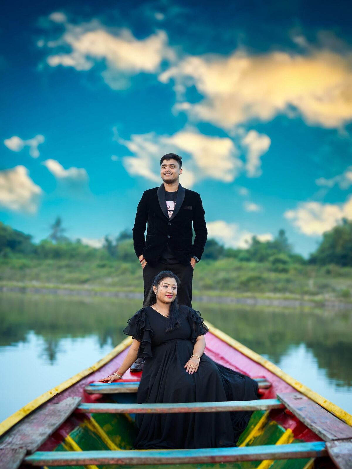 Couple on a boat beneath a blue sky