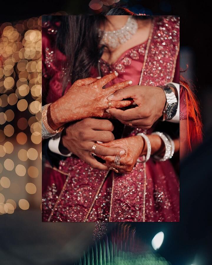 Couple's hands, mehendi and bangles
