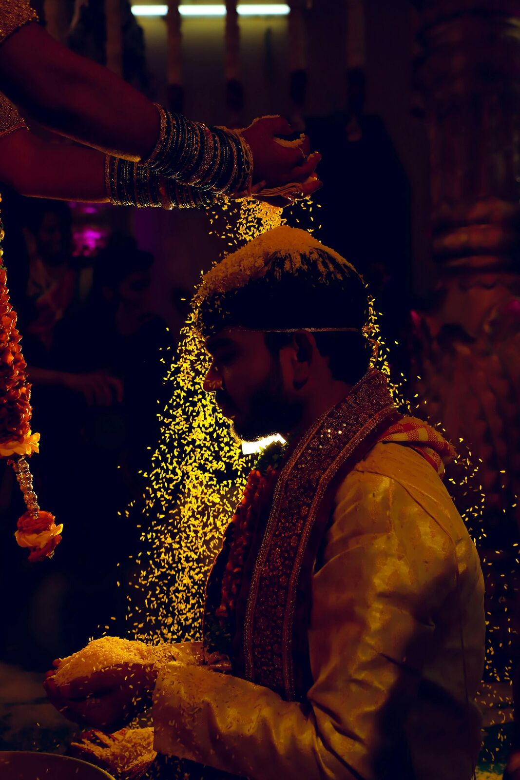 Groom during a wedding ritual, golden light
