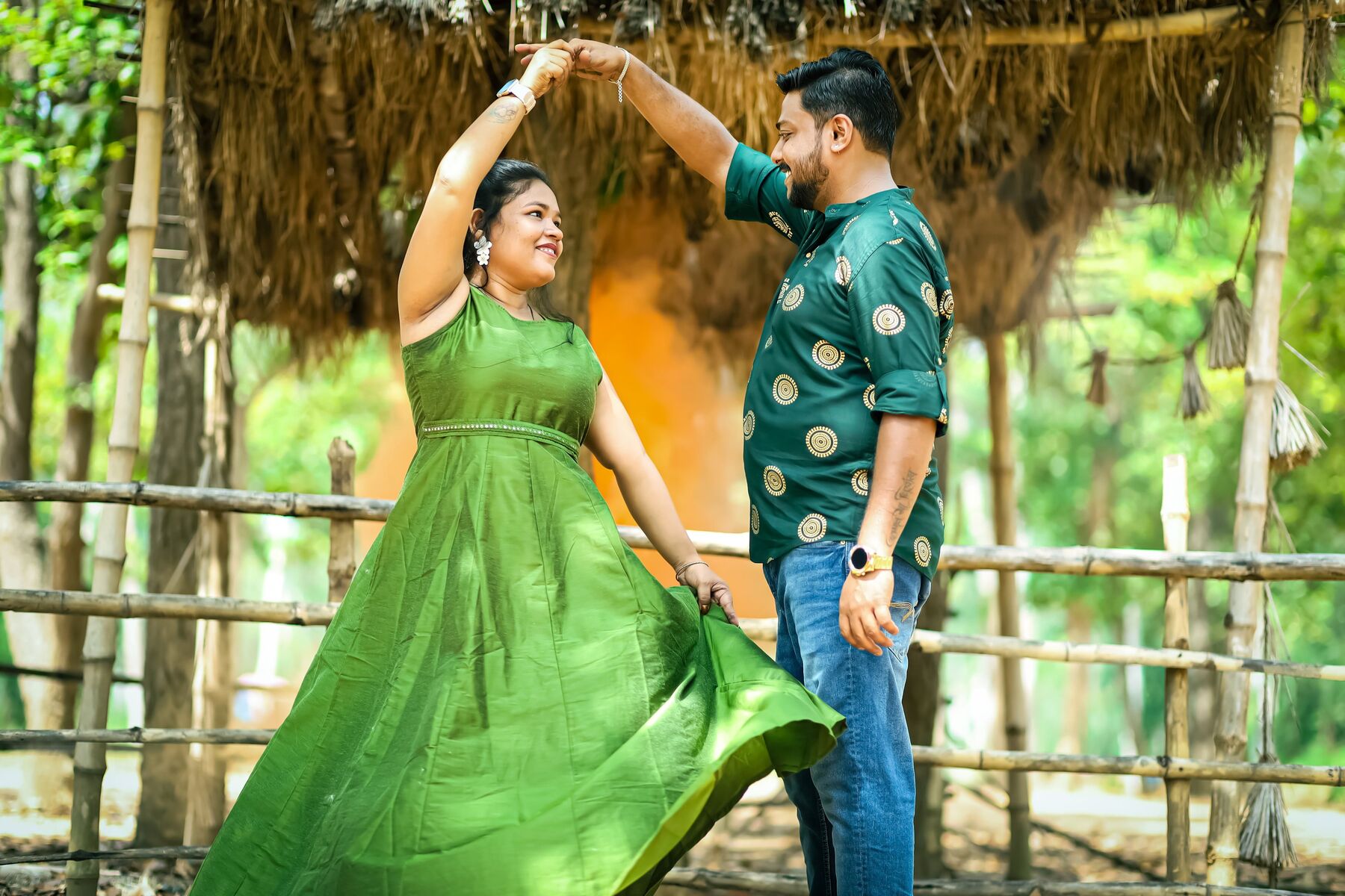 Couple dancing in a bamboo-hut setting