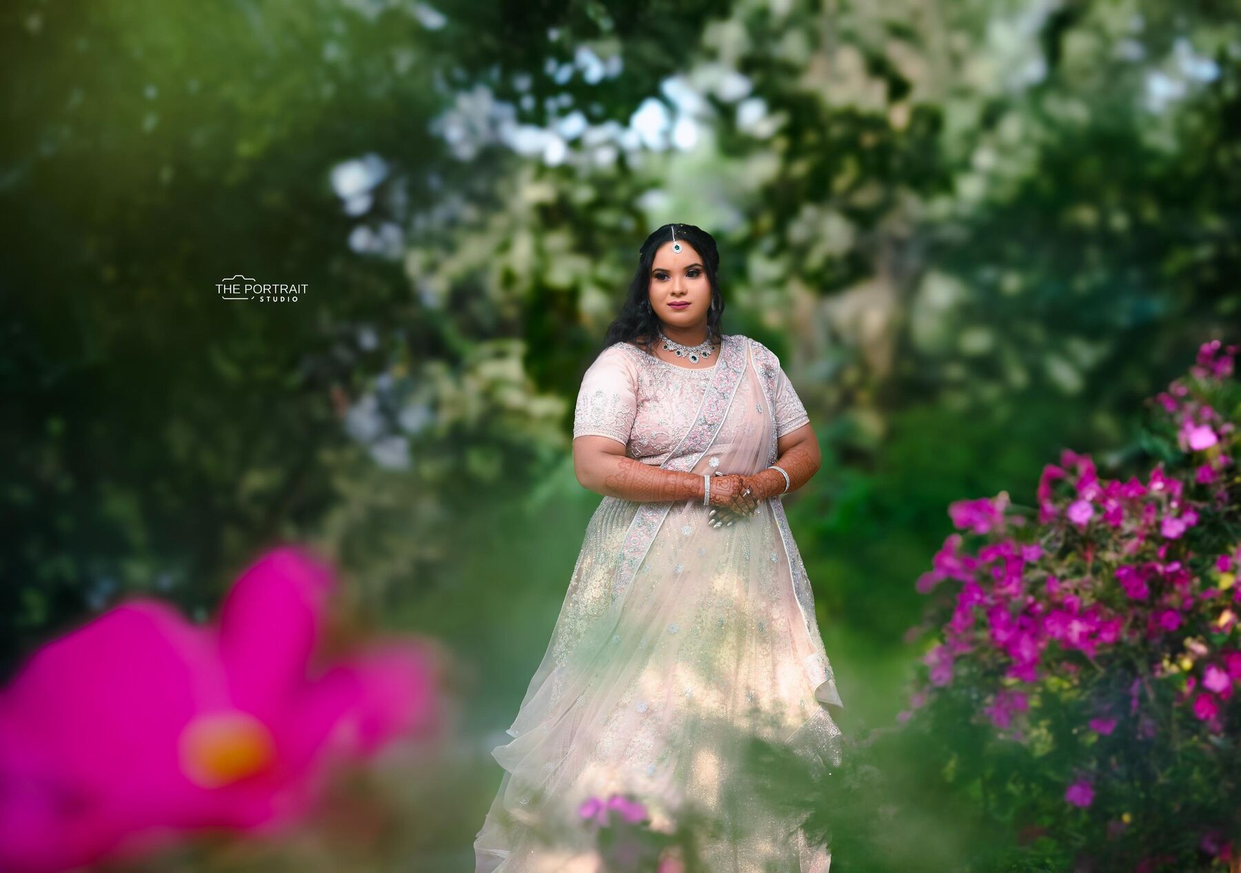 Bride portrait among garden flowers, The Portrait Studio